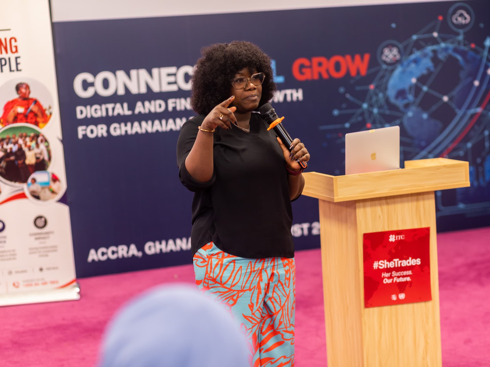Rita Naa Kordey Clottey speaking with a microphone at the Connect, Sell, Grow digital and financial growth event in Accra